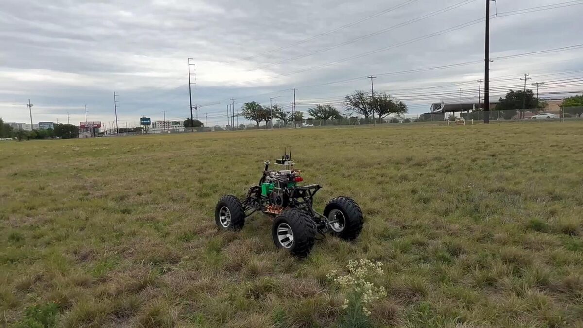 ATV chassis on its own in a grass field during a ground test