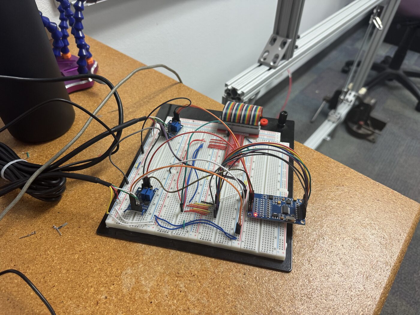 The dual load cell amplifier and ADC circuit built on a breadboard, connected to a Raspberry Pi